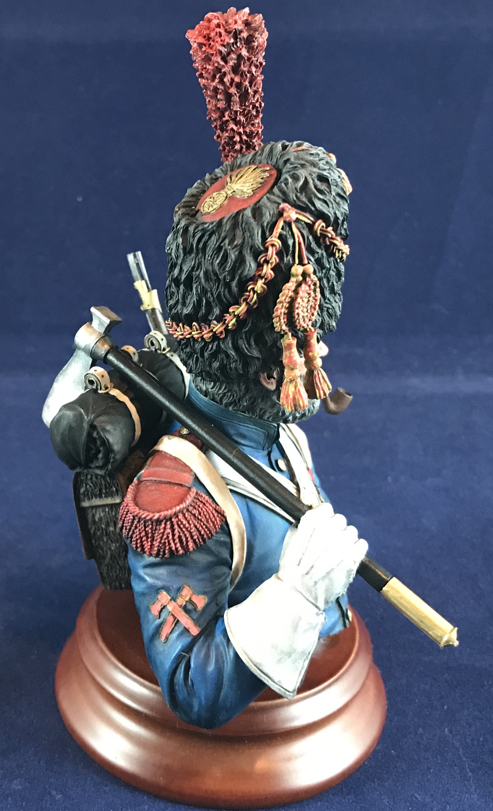 The thread where we can talk about painting figures. - Page 4 - Scale Models - PistonHeads - The image showcases a miniature figurine of a man in uniform, which includes a hat with feathers, a jacket adorned with decorations, and a sash. He is also wearing trousers and boots. The figure is standing on a base, which resembles an old-fashioned globe, adding to the historical theme. In his hand, he holds what appears to be a rifle or a similar weapon from that time period. The figurine is positioned against a dark background, emphasizing its details and colors.