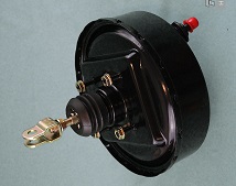 Know anything about Servo's ? - Page 1 - S Series - PistonHeads - The image shows a close-up of an electric motor with its casing removed. The motor is set against a blue background. There is a prominent electric cord plugged into the top of the motor, and a small gold-colored piece of hardware is attached to it. The motor appears well-maintained and functional.