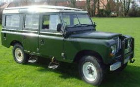 Day Fathers Repurchased Pistonheads Landy Present - The image showcases a vintage military-specification jeep parked on a grassy area. The jeep is coated in a dark green color, reflecting a faded appearance, suggesting it may be older or has withstood a significant amount of use. The vehicle is equipped with a fabric soft top, indicating it might be used for specialized purposes such as surveillance or outdoor activities. The jeep has a robust appearance, withheavy-duty tires and a rugged exterior that is characteristic of military vehicles designed for off-road capabilities. Despite its age, the jeep seems to be well-maintained and functional.