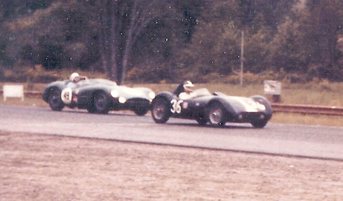 Early TVR Pictures - Page 34 - Classics - PistonHeads - The image captures a moment of motion on a road through a forested area. It features a classic race car, with the number 35 visible, signifying a racing event. The car is pointing to the right, suggesting it's either turning or moving that direction. There are trees on both sides of the road, providing a serene backdrop to the action in the foreground. It seems to be an image from the past, given its grainy and slightly aged appearance.