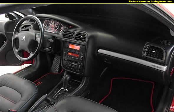 Peugeot 407 Coupe - Page 1 - French Bred - PistonHeads - This image showcases the interior of a car, focusing on the gear shift and the view pointing towards the front of the vehicle. The gear shift is prominent, located in the center console, and it appears to be a model specific to some type of Peugeot. The backdrop of the photo is the driver's side, suggesting a sense of space and openness in the vehicle's cabin. The bright lighting illuminates the detailed design of the car's interior, and there are no visible texts or brands. The image conveys a sense of luxury and personal space, emphasizing the elegance of the vehicle's design. The photo seems to be taken during the day with considerate attention to the automobile's aesthetics.