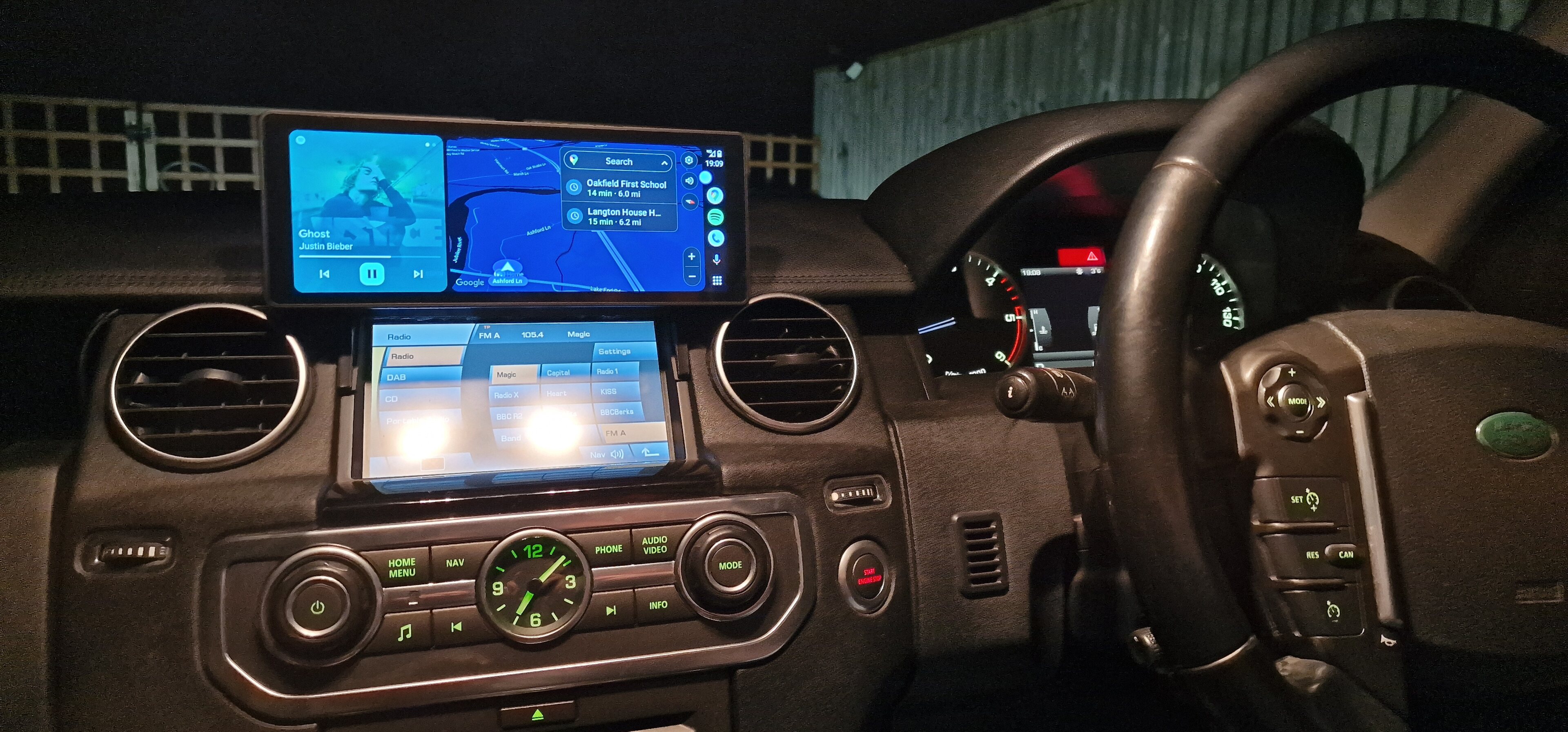 Pistonheads - The image shows a vehicle's interior, specifically the cockpit and dashboard area. At the center of the dashboard is a screen displaying various car-related information such as speed, fuel level, and engine status. The steering wheel, visible on the left side, features controls for the car's infotainment system. The vehicle appears to be an SUV or a crossover type vehicle.