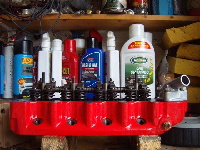 pics - Page 1 - Classic Minis - PistonHeads - The image presents a well-organized shelf, filled with an array of automotive and mechanical maintenance items. Bottles of various spray fluids, such as motor oil and brake fluid, are neatly lined up, along with plastic containers and aerosol cans. Each item has its dedicated space, indicating a thoughtful arrangement designed for efficiency and accessibility.

In addition to the bottles and cans, there's a notable collection of car repair products including a tube of tire repair goo. This could suggest that this space is used for addressing a range of vehicle issues, from preventive maintenance to minor repairs.

The overall scene suggests a DIY automotive enthusiast's personal garage, set up to allow for a multitude of vehicle maintenance tasks.