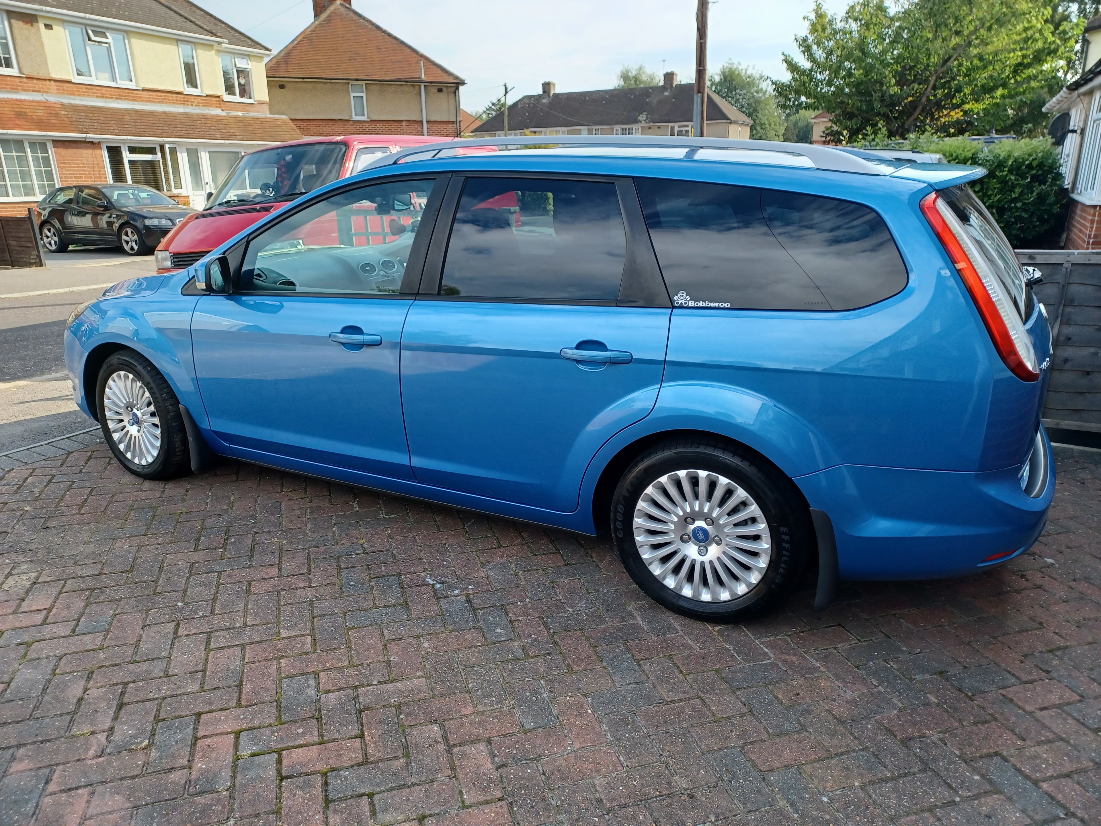 Tell Us Something Really Trivial About Your Life Volume 37 - Page 283 - The Lounge - PistonHeads UK - The image shows a blue Ford Fiesta parked on a brick pavement. It's a hatchback model, identifiable by its distinctive shape and compact size. There are tinted windows visible on the car, suggesting privacy or sun protection features. A small black badge is also noticeable on the trunk of the vehicle. The car appears to be in good condition, with no obvious signs of damage or wear.