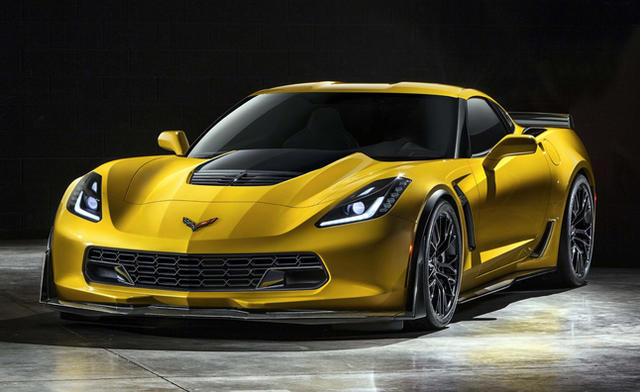 C7 Z06  - Page 1 - Corvettes - PistonHeads - The image displays a sleek, modern yellow car illuminated on a reflective surface. The car features a dynamic design with aerodynamic lines and a long, sleek hood. The body of the car appears to be made of a polished material, reflecting the interior studio lights. The vehicle's stance and shape, along with the lighting, give it an aggressive and bold appearance.