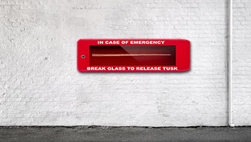 Juvenile things that make you snigger vol 2 - Page 303 - The Lounge - PistonHeads - The image shows a scene where there is an emergency response vehicle. The vehicle is red and parked next to a white wall. On the vehicle, there is a sign that reads "IN CASE OF EMERGENCY BREAK GLASS TO RELEASE TRUCK." This suggests that the vehicle may be equipped with safety measures or has been designed for quick deployment in case of an emergency. The setting appears to be outdoors during daylight, as indicated by the natural light and shadows visible on the ground.