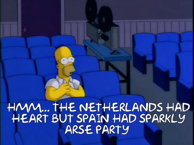 Eurovision 2022 - Page 56 - TV, Film, Video Streaming & Radio - PistonHeads UK - The image is a meme that features Homer Simpson from the animated TV show "The Simpsons." He appears to be in a movie theater, sitting alone in an empty row of chairs. Superimposed on the image are white text bubbles. One says, "Homer: Maybe I'll just sit here and think about the heartlands." Another reads, "Homer: I mean, I love you Spain, but I don't need your sparkly parties. Ain't no party like a Homer Simpson party." The meme seems to be poking fun at Homer's character in relation to his thoughts and opinions on events or activities taking place in the fictional "heartlands" region of Spain, suggesting that he prefers a quiet, peaceful environment rather than crowded parties.