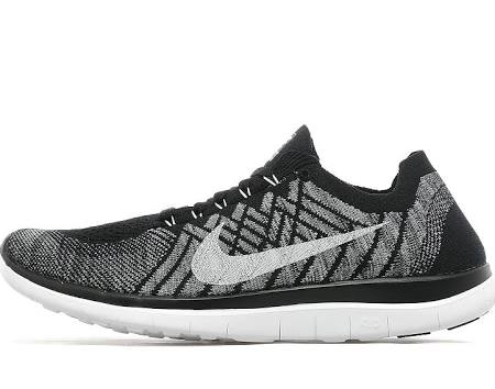 Does anyone have Nike Flyknit trainers? - Page 1 - Sports - PistonHeads - The image is a product photo of a sneaker. The sneaker features a blackknit upper with a pattern of lighter grey stripes. Brands 'Nike' is visible on the side, and the sole appears to be white with grosgrain detailing. It is designed with a collar on top to sit snugly around the ankle. The image has a white background, which generates a clean and balanced focus on the sneaker.