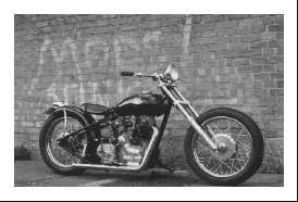 New (almost) SR3 owner...few questions - Page 1 - Radical - PistonHeads - The image is a black and white photograph of a custom motorcycle. It has a prominent front fairing and features classic elements such as spoke wheels, a single-seat saddle, and a flared rear fender. The bike is leaning on a brick wall, which also has a piece of text painted on it. The outlaw motorcycle club affiliation suggests that the motorcycle is often used for transportation or events, and the grayscale tone of the photo has a vintage or timeless appeal. Overall, the image captures the essence of freedom and rebellion often associated with outlaw motorcycle culture.