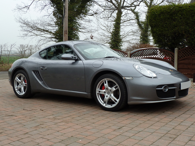 Dareen wanted pictures.... - Page 1 - East Anglia - PistonHeads - The image features a silver sports car resting on a brick driveway. The vehicle, likely a Porsche given its sleek design and the visible emblem, is parked facing to the left with an elegant, low-profile stance. The surrounding environment is simple with trees in the background. The composition of the image suggests it was taken during daylight as there is ample natural light illuminating the car and its immediate surroundings. The brick driveway provides a contrasting texture to the smooth paint of the car.