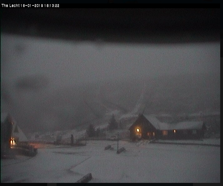 The wet and windy, with occasional snow, 2018/2019 thread  - Page 41 - The Lounge - PistonHeads - The image shows a snowy landscape, with a village or small town visible in the distance. There's a notable amount of snow covering the ground and possibly on the rooftops of the buildings. The sky is overcast, suggesting that it might be in the middle of a storm. On the left side of the image, there is a text overlay that reads "The Leth-13 09:26" which could indicate a timestamp or perhaps some reference to a location or event. There's also a watermark with an obscured code on the bottom right of the photo. The overall scene captures a wintry rural setting, possibly during a heavy snowfall.