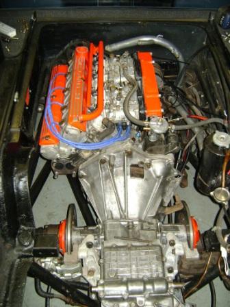 Pictures from Paul Roach's Open Day - Page 1 - Classic Cars and Yesterday's Heroes - PistonHeads - The image shows the interior of a powerful engine, possibly a V8. It's difficult to discern specific make or model. The engine appears to be neatly laid out with various components.