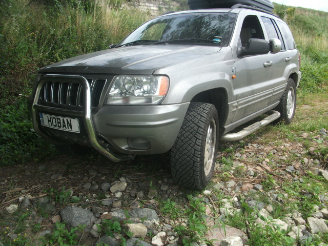 Cheap 4x4 for winter suggestions? - Page 5 - General Gassing - PistonHeads - The image shows a gray SUV parked on a grassy, rocky field. The vehicle is a compact SUV, with its front face towards the camera. The visible license plate of the vehicle is illegible due to the image resolution. The SUV is equipped with a rack on top, and the surrounding area suggests an outdoor, possibly wilderness setting. The condition of the vehicle appears to be well-maintained, with no visible signs of damage or wear.