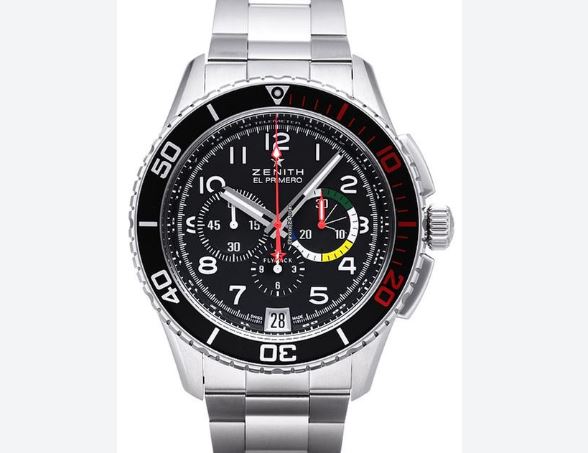 Sporty chronographs? - Page 1 - Watches - PistonHeads - The image shows a silver wristwatch with a black dial and silver markings. The watch has two large, 3-dimentional sub-dials for chronograph functions. Text on the watch face includes the words "ZENITH" above the main dial, and "EL PRIMERO" below it. The hands of the watch are silver-toned with a red second hand. The brand name "ZENITH" appears on the face of the watch and also near the 12 o'clock position. The bezel is silver with tachometer markings, and the rest of the watch is constructed with stainless steel. The watch appears to be of a modern design, primarily featuring white and red color accents.