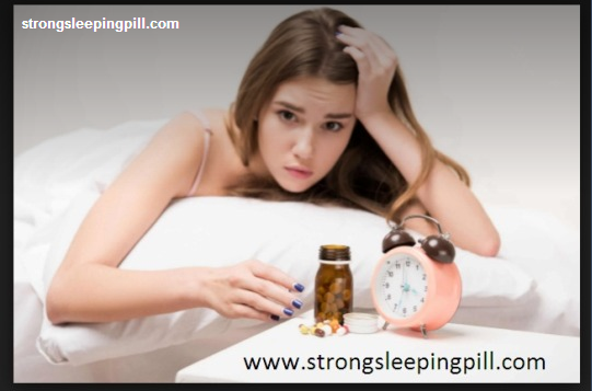 A woman sitting in front of a laptop computer - Pills Insomnia Disorder Health Sleeping