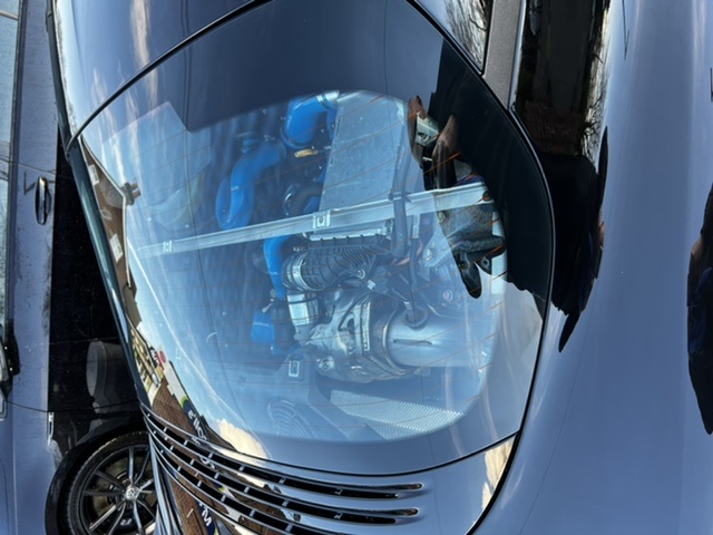 A close up of a mirror reflecting a bus - Pistonheads