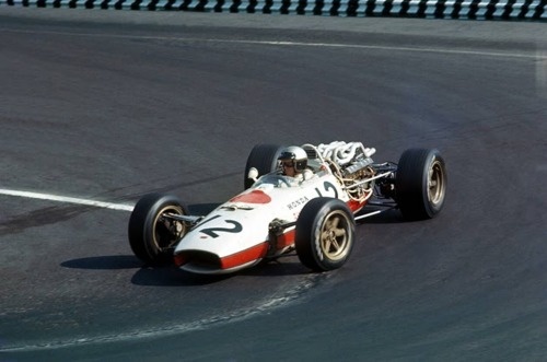 A motorcycle is parked on the side of the road - Pistonheads - In the image, a vintage race car is visible, exhibiting features characteristic of these vehicles. The race car is in motion on a race track, captured as it takes a sharp turn. Its design is reminiscent of classic race cars from the early to mid-20th century. The race track on which it is running seems well-maintained and designed for high-speed events. The light source in the lower part of the image suggests that this was taken during the day due to the brightness and clear visibility of all elements in the scene.