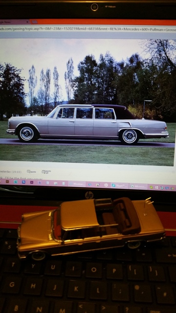 RE: Mercedes 600 Pullman Grosser: Spotted - Page 1 - General Gassing - PistonHeads - The image showcases a classic station wagon, painted in a vibrant shade of yellow against a contrasting background. This vintage car is the centerpiece of a website page, displayed on a large monitor. Above the car on the website, there's a red banner indicating a link related to this vehicle. The scene is completed by a small toy car, also painted in the same shade of yellow, either a sign of affection for the car or used as a design element for the webpage.