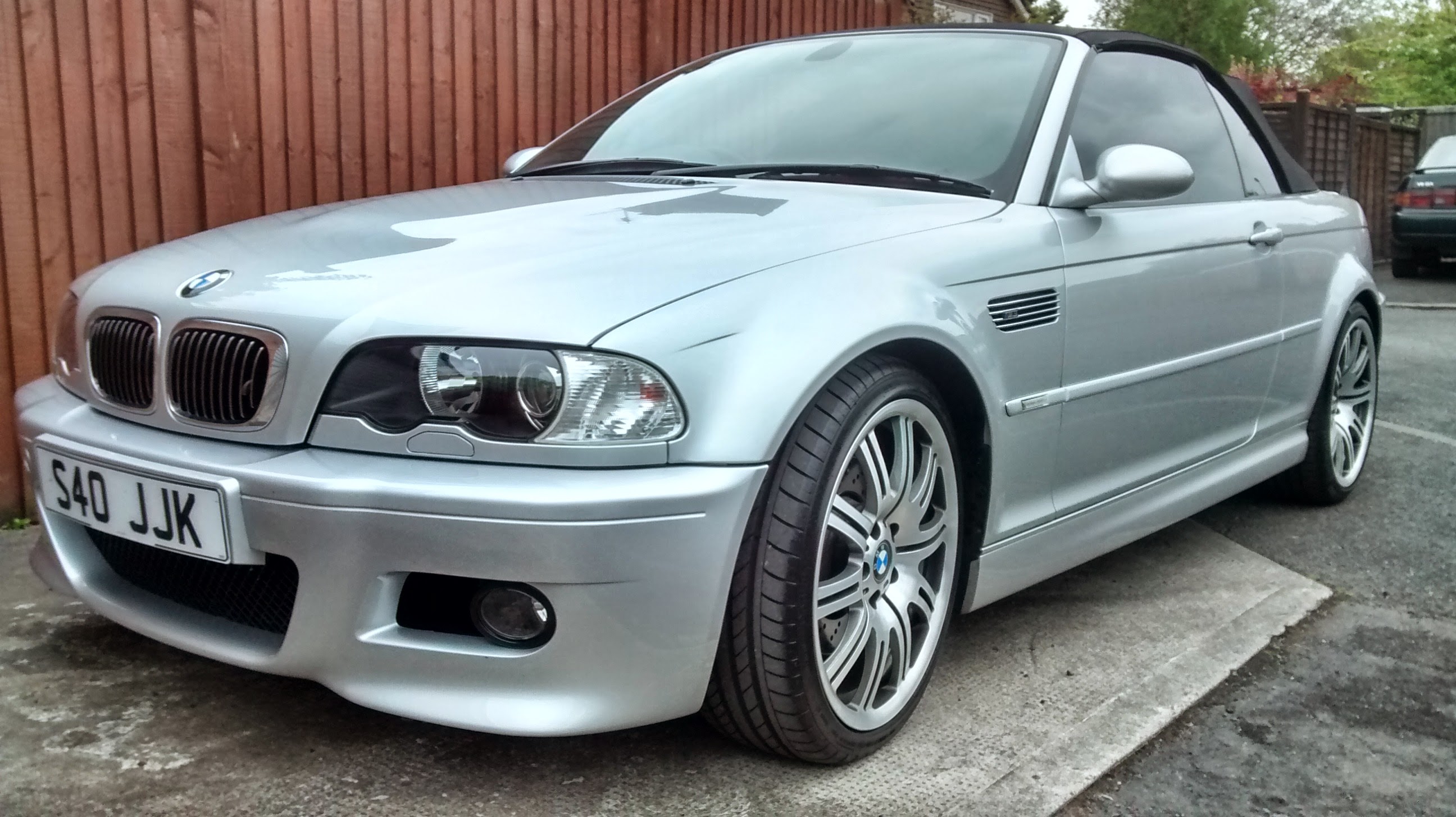 E46 M3 convertible - Page 3 - M Power - PistonHeads - The image features a silver BMW car parked on a cement surface. The car is positioned at an angle, giving a view of its front and side. The BMW has black unicaps, and there's a license plate displaying "540 JUK". The vehicle is well-maintained, and its sleek design is typical of BMW cars. The setting appears to be a residential area with a fence visible in the background.