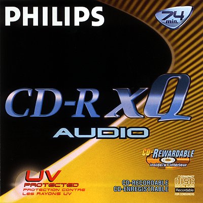 Fob Stereo Pistonheads Questions Key - The image is an advertisement or product picture for Phillips CD-R Audio Discs. The prominent word "PHILIPS" is featured at the top in large white block letters. Below this, the text "CD-R XQ AUDIO" is displayed in a large, bold font on a black background. In the lower portion of the image, there are three smaller pieces of text: "U V PROTECTED protection contrac les raysons UV," "CD-R REWARDABLE inside/out," and "RECORDABLE DISC RECORDABLE for console/externe." There's also a circular red stamp in the bottom right corner with "INTERNATIONAL WARRANTY" written around it in white, indicating the presence of a warranty for the product. The style of the image suggests it's an old-era advertisement, possibly from the late 1990s to the early 2000s, given the font style and aesthetic.