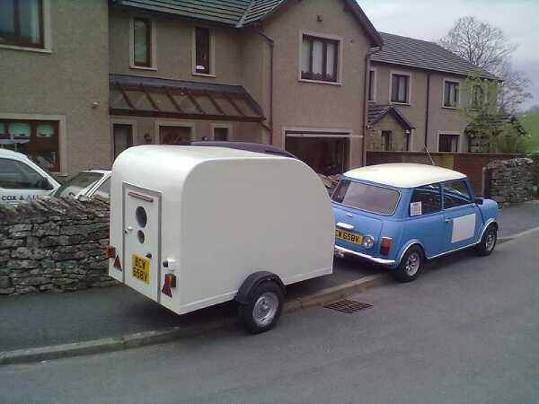 A white van parked in front of a building - Pistonheads