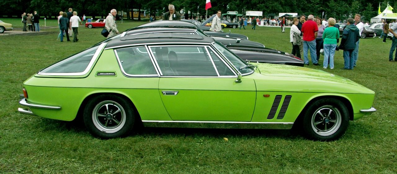 Yesterday's colours: best colour on a car - Page 4 - General Gassing - PistonHeads - The image showcases an older model of a green two-door car, which appears to be in fine condition. It's parked on a grassy area, possibly a car show or similar event. There are several people around the car, likely admirers or participants in the event. The setting is outdoors, and the grass is green, adding a natural and vibrant backdrop to the scene.