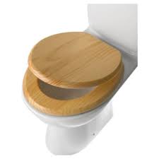 The Wedge Sausage Meet - Page 65 - Wedges - PistonHeads - The image features a toilet that has been uniquely designed with a wooden seat lid. The wooden seat lid is light in color, with visible wood grain, contrasting with the white ceramic bowl of the toilet. The toilet is situated against a plain white background, highlighting the design of the wooden seat lid. It's a product image, likely for an advertisement or catalog, showcasing the seat lid for potential buyers. The overall style of the image is clean and minimalist, focused on the toilet seat lid and its design.