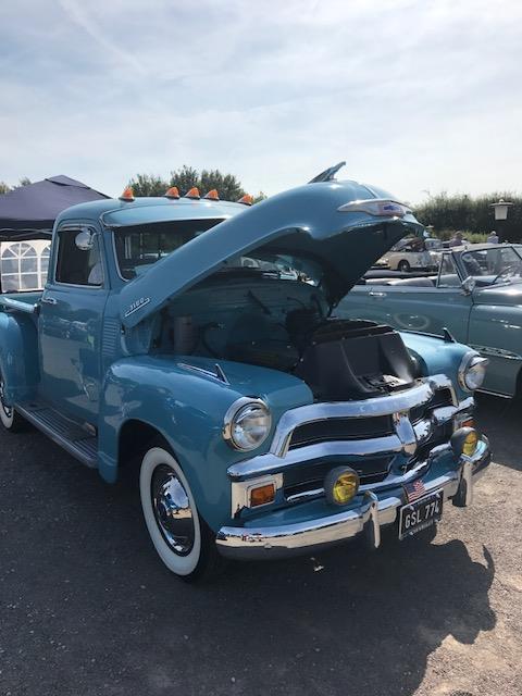 A blue truck parked in a parking lot - Pistonheads