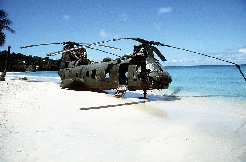 Post amazingly cool pictures of aircraft (Volume 2) - Page 252 - Boats, Planes & Trains - PistonHeads - This image showcases a scene on a sandy beach. Dominating the scene is a large, old military helicopter, sporting a weathered appearance. The helicopter is tilted to the side, as if it were caught mid-landing. The color palette of the photo is drawn mainly from earthy tones, with the sandy beach contributing to the overall vintage, war-theme aesthetic. The vast expanse of the ocean and a clear sky can be seen in the distance, adding a sense of openness to the scene. Despite the apparent age and condition of the helicopter, it instills a sense of history and intrigue.