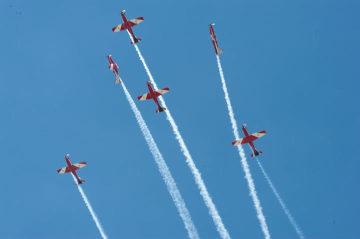 Oz GP Flypasts - Page 1 - Boats, Planes & Trains - PistonHeads - The image captures an impressive display of aerobatics, featuring six jets flying in formation against a clear blue sky. Each jet is leaving a trail of exhaust behind it, creating a dynamic and eye-catching spectacle. The formation showcases precise alignment and control, as the planes maintain their positions relative to each other. The image conveys a sense of speed, agility, and teamwork.