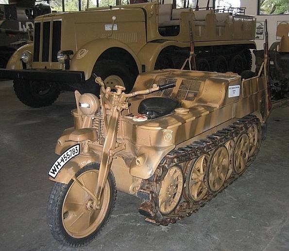 Elvington Bmw Rss Pistonheads - The image features an antique military truck, complete with guns, displayed indoors. It's predominantly olive green with black and tan details and large off-road tires. The visible seat appears to be made of leather with buckles, and there's a plate with a logo that reads "WH-55 853." The setting suggests a historical exhibition or museum.