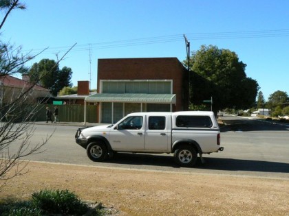 A white truck parked in front of a building - Pistonheads