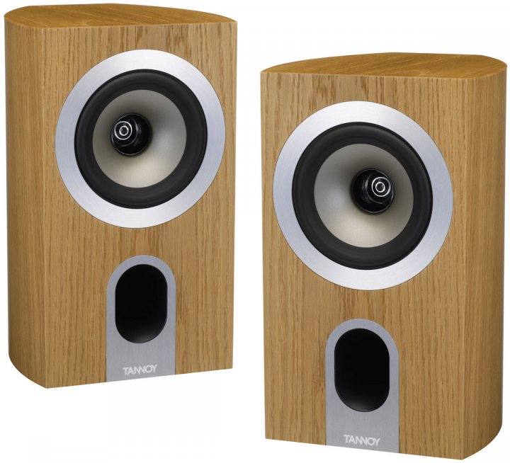 Pistonheads Standmount Speakers - The image shows a wooden-effect, two-tone vertical speaker system. Each speaker is built into a wooden base, with a darker wood grain central on both sides. The speakers are white and black, distinguishing the left and right to represent a stereo setup. The fabric dome on each speaker suggests quality and attention to design. There is a visible brand name 'TanoA' on the side of each speaker, indicating the manufacturer.