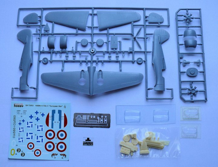 Special Hobby 1:72 Curtiss Hawk H-75 - Page 1 - Scale Models - PistonHeads - The image showcases a model toy airplane, laid out carefully on a white surface. It's composed of numerous pieces, including wings, a fuselage, and various smaller components, all presented in a systematic manner. A parts list, featuring largely numbers and letters, accompanies the model, seemingly indicating the sequence of assembly or perhaps providing due diligence from the user. The overall scene conveys the prospect of a DIY craft project.