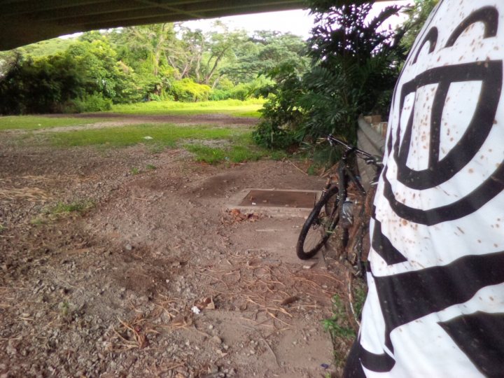 The "Photos From Today's Ride" thread... - Page 150 - Pedal Powered - PistonHeads - The image shows an outdoor scene with a pile of gravel, and a bicycle parked on a path next to a large, boulder-like structure that appears to be covered in white marks or spots, creating a stark contrast against its dark base or background. The background is also a natural setting with green leaves visible, suggesting this might be in a forest or park. The white and black pattern on the main object in the foreground is unclear from this perspective, but it seems like some textile or signage. There is a solitary figure in the bottom right corner, however, their back is to the camera, and they are not interacting with the main elements in the scene. Overall, the scene is somewhat open and unstructured, with no immediate signs of deliberate action or activity.