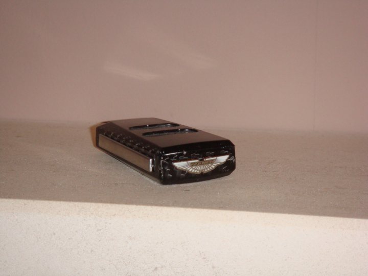 A cell phone sitting on top of a table - Pistonheads