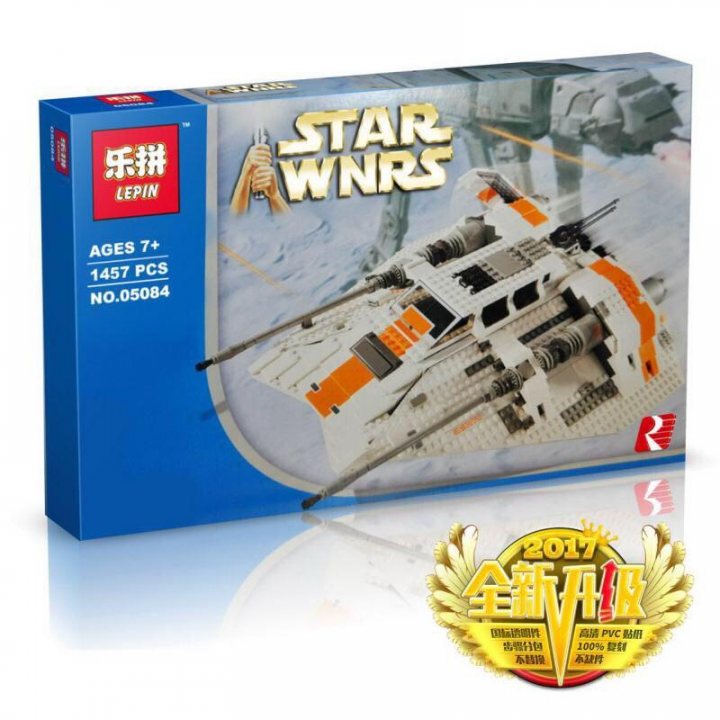 A pair of scissors sitting on top of a table - The image shows a LEGO Star Wars boxed set. The box features the toy's design, with a detailed representation of the spaceship modeled after the Millennium Falcon from the Star Wars franchise. In the background, there are two smaller models that appear to be TIE Interceptors, which are characteristic of Star Wars spaceships. The box includes a LEGO logo and various certification marks. The text on the box indicates that the model consists of 1,457 pieces and is age-suggested for ages 7 and above. There's also a note mentioning that LEGO Star Wars sets are not intended for children under 3 years of age. On the right side, there's a circular emblem with the LEGO Star Wars logo and additional accolades such as the '2017 Star Ranking,' '100% Designated,' and the '100% Buildable Design.'