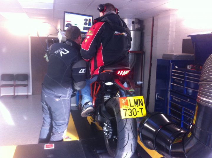 A man on a motorcycle in a garage - Pistonheads
