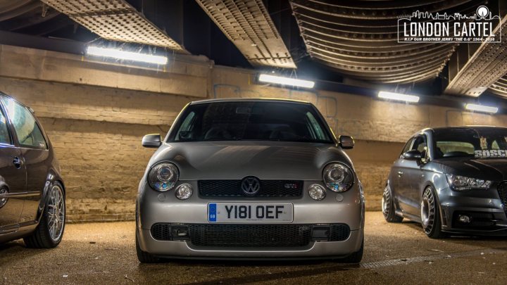 RE: Silverstone Sunday Service 05/03 - Page 5 - Sunday Service - PistonHeads - The image depicts a collection of Volkswagen cars parked together, seemingly in a dimly lit environment. The longest car, which may be a hatchback, remains in profile, while the three shorter cars, possibly sedans, are shown from a three-quarter view. The word "LONDON" is printed across the bottom of the photo, indicating that the location could be London or the image may be associated with London. The lighting suggest either an indoor parking area or an outdoor parking area with sufficient ambient light to illuminate the setting. The vehicles themselves are predominantly silver, and the number plates visible indicate a country that uses Alphanumeric license plates.