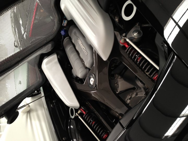 A bunch of luggage that are sitting on the floor - Pistonheads - The image is a close-up photograph showing the top part of an engine bay compartment of a motor vehicle. You can observe various mechanical components including a starter motor, battery housing casing, and possibly parts of the recycling system. The materials appear to be metallic and the overall tone of the photograph is industrial and technical. The style of the image is realistic, with a focus on mechanical engineering.