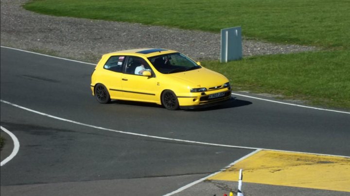 A yellow taxi cab parked on the side of a road - Pistonheads