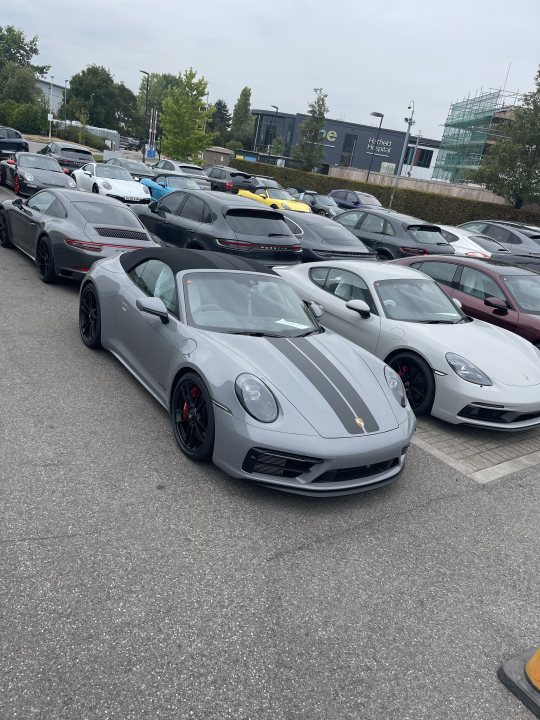 A bunch of cars parked on the side of the road - Pistonheads