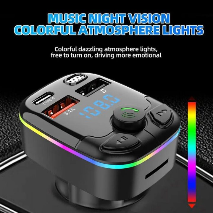 The image shows a night vision device, specifically a colorful atmospheric light gadget. It is designed to be portable, featuring a black and gray casing with multiple buttons on the side, suggesting various functions or settings. The branding includes text that reads "MUSIC NIGHT VISION" and "COLORFUL ATOMSPHERE LIGHTS," indicating the product's capabilities for enhancing music at night. In addition to these features, it appears to have a built-in flashlight and possibly other illumination options. The device is depicted against a dark background with a textured surface that resembles a metallic or carbon-fiber finish. At the top of the image, there's an arrow pointing upwards with the caption "10% OFF," suggesting a promotional discount for the product.