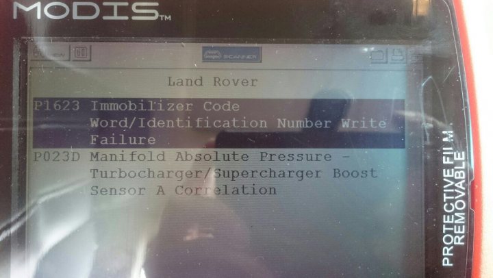 Range Rover vogue issue HELP - Page 1 - Home Mechanics - PistonHeads - The image shows the screen of a device, seemingly some form of electronic equipment, which appears to be a car's onboard diagnostics tool (OBDII) known as MODIS. The screen displays various pieces of information, such as a sequence of numbers for a Land Rover engine P1623 code. It also lists words/identification numbers for failure: "WORD/IDENTIFICATION NUMBER WRITE" followed by "FAILURE" with a description, a location "TURBOCHARGER/SUPERCHARGER BOOST," a "SENSOR A CORRELATION." The text "P223D MANIFOLD ABSOLUTE PRESSURE" is also visible on the screen. The number "12345" appears prominently, possibly indicating an error code or some kind of count.