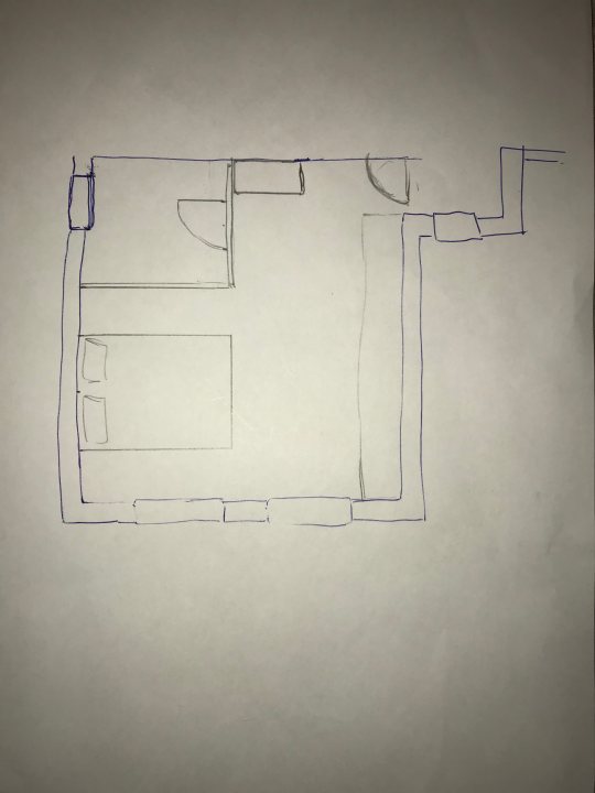 Extension above garage - new bedroom planning - Page 1 - Homes, Gardens and DIY - PistonHeads - The image is a piece of paper filled with a hand-drawn blueprint. The layout appears to be a combination of rectangles, lines, and shapes, possibly representing a building layout. This blueprint could be an architectural or engineering diagram mapping out the structure and rooms. The complexity and detail may suggest more intricate designs, like a floor plan.