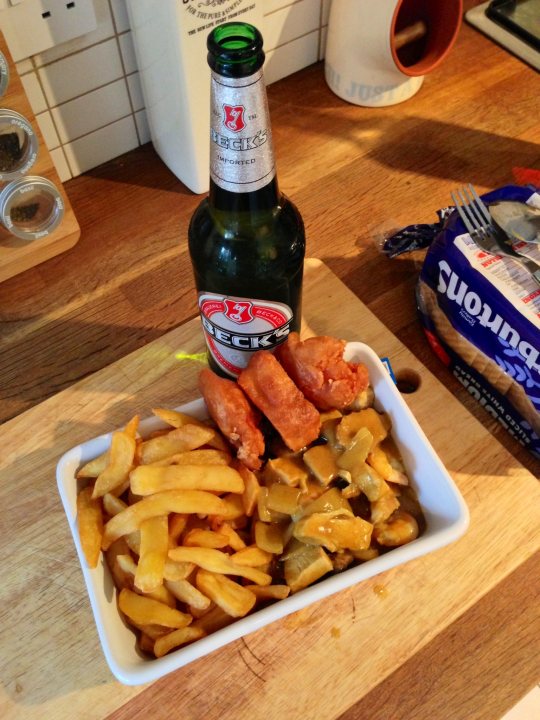 A hot dog and french fries on a plate - Pistonheads