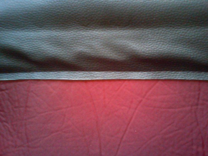 TVR Targa panel roof bags.. - Page 1 - Wedges - PistonHeads - The image captures a close-up view of textured fabric with visible seams and stitching. The fabric has a prominent texture that creates a semi-circular pattern. There is a distinct seam and stitching running vertically down the fabric, providing a strong line of contrast between the smooth top layer and the textured lower layer. The overall appearance suggests the fabric could be a part of a sewn or assembled garment, such as a jacket or a bag.