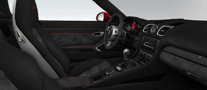 Pistonheads - The image displays a luxurious interior of a car, featuring a convertible top open, allowing full visibility into the cabin. The seats are upholstered in black leather with red accents, and there are space enclosures visible between the seats, suggesting ergonomic legroom for passengers. The dashboard has numerous controls and gauges, indicative of high-end technology that likely includes infotainment capabilities and various driver assistance features. The image is a 3D rendering or a high-quality photograph that focuses on the vehicle's interior design, prioritizing realism and attention to detail.