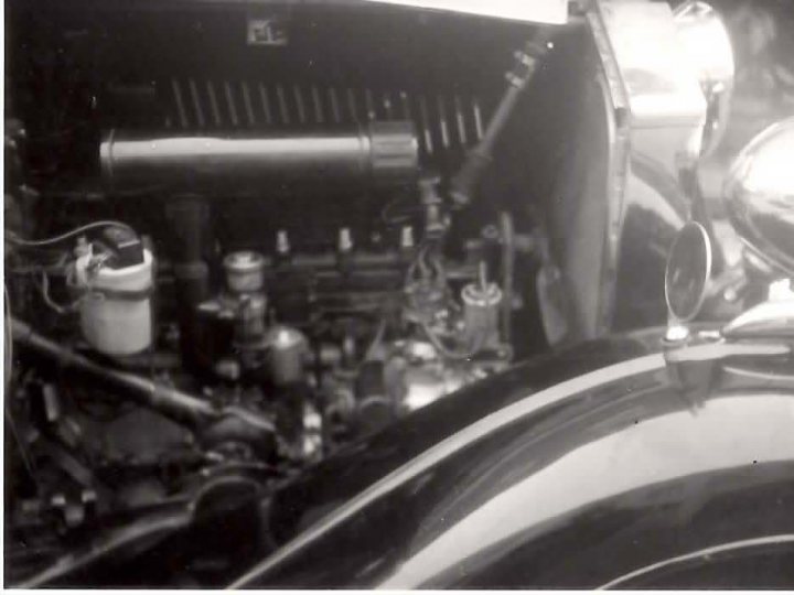 B&W Bentleys.... - Page 1 - Rolls Royce & Bentley - PistonHeads - The image captures the intricate details of the engine compartment of a classic Cadillac car. The car's engine, a central focus of the image, highlights its robust and complex design. Various mechanical parts and equipment are visible, demonstrating the vehicle's functional components. The black and white nature of the image suggests that it is of vintage origin, further enhancing the car's classic and timeless appeal. The setting of this photograph might indicate a repair garage or a garage dedicated to preserving vintage automobiles.