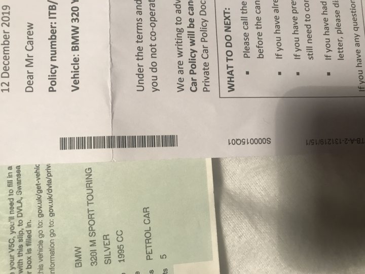 Cheap nippy hatchback for a 17 year old - Page 1 - Car Buying - PistonHeads - The image shows a paper ticket, likely for an event or service, with text and symbols. It is partially obscured by a blurry foreground object, making some details difficult to discern. The ticket includes a barcode, numbers, and what appears to be a vehicle registration number or license plate. There is also a date mentioned on the ticket: "19/12/30". In the background, there's a receipt with text and numerical values, but it's not fully clear due to the overlaid image. The overall style of the image suggests it was taken casually without much attention to detail or composition.